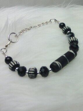 Beautiful handmade bracelet with engraved elk bone beads, crystals & beads